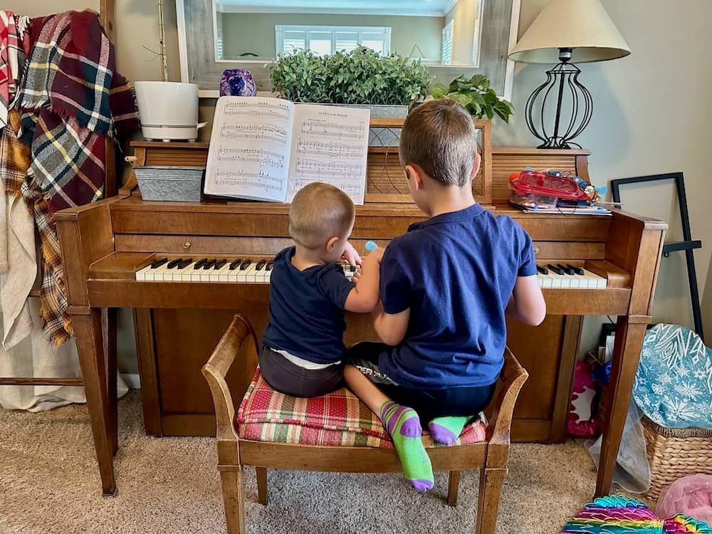 My 2 boys playing on the piano