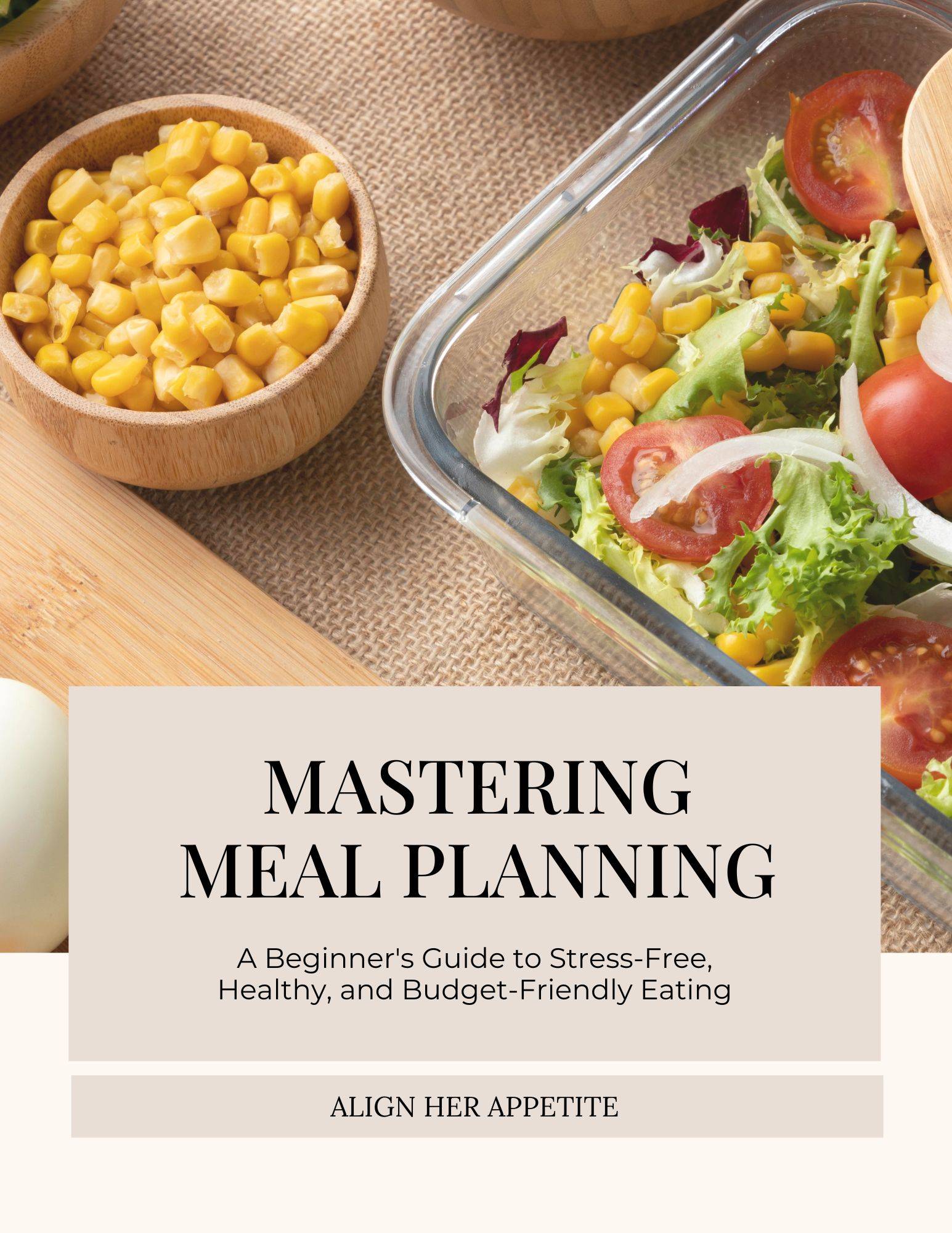 A book cover titled "Mastering Meal Planning" by Align Her Appetite. The subtitle reads "A Beginner's Guide to Stress-Free, Healthy, and Budget-Friendly Eating." The background features a fresh salad with corn, lettuce, and cherry tomatoes, along with a bowl of corn and a rustic fabric surface.