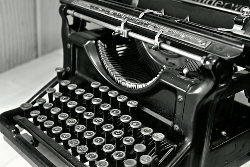 Close-up of an antique black typewriter keyboard.