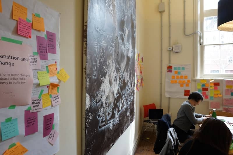 a group of people sitting at a table in a room