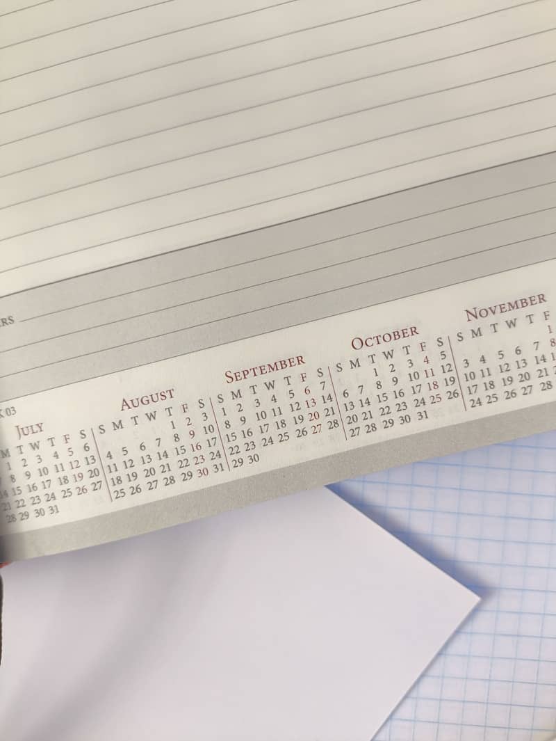 A printed calendar page showing months from July to November on lined paper