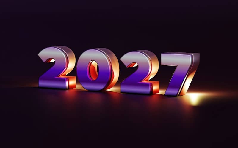 The number 2027 in metallic purple and gold lettering on a dark surface