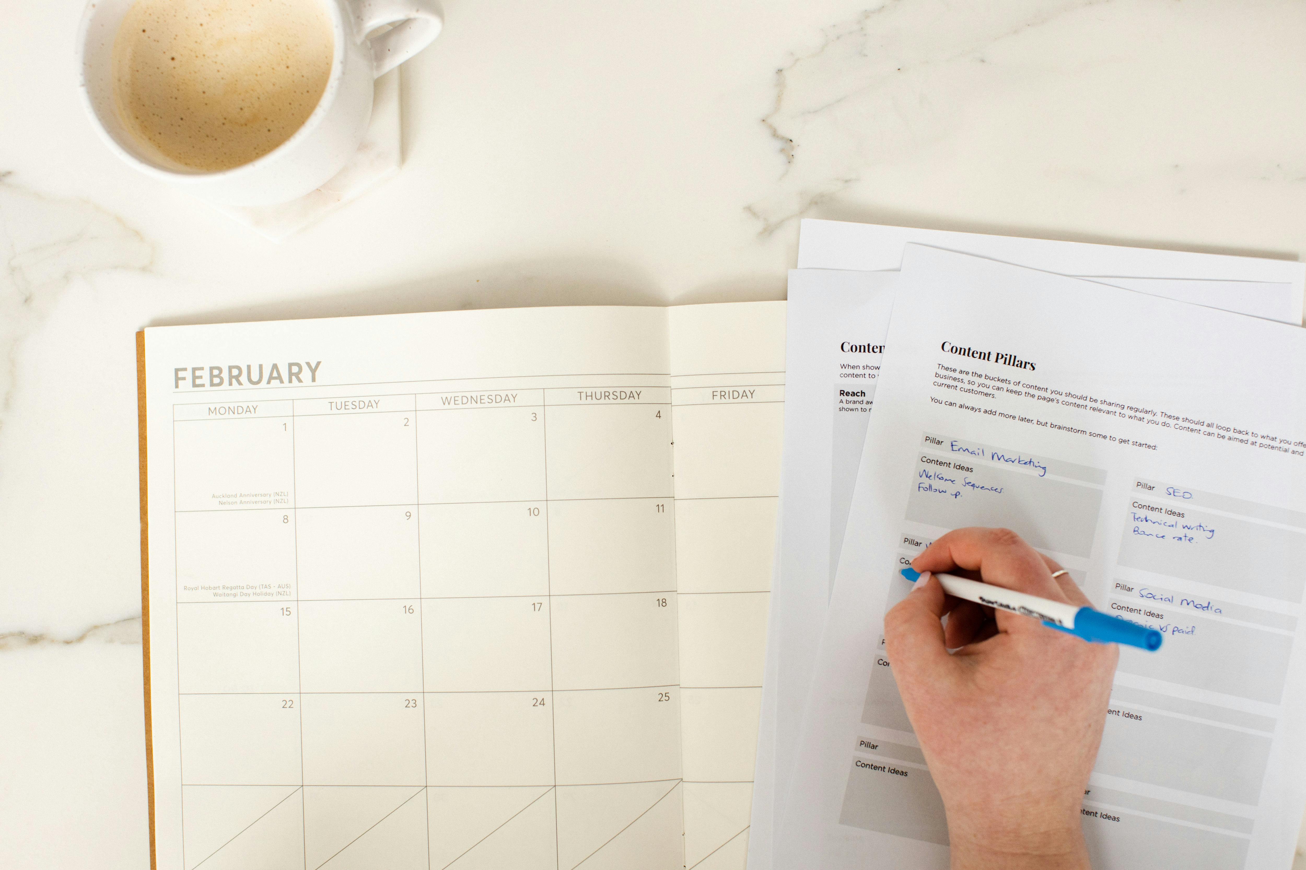 Photo of Emma planning a calendar for February