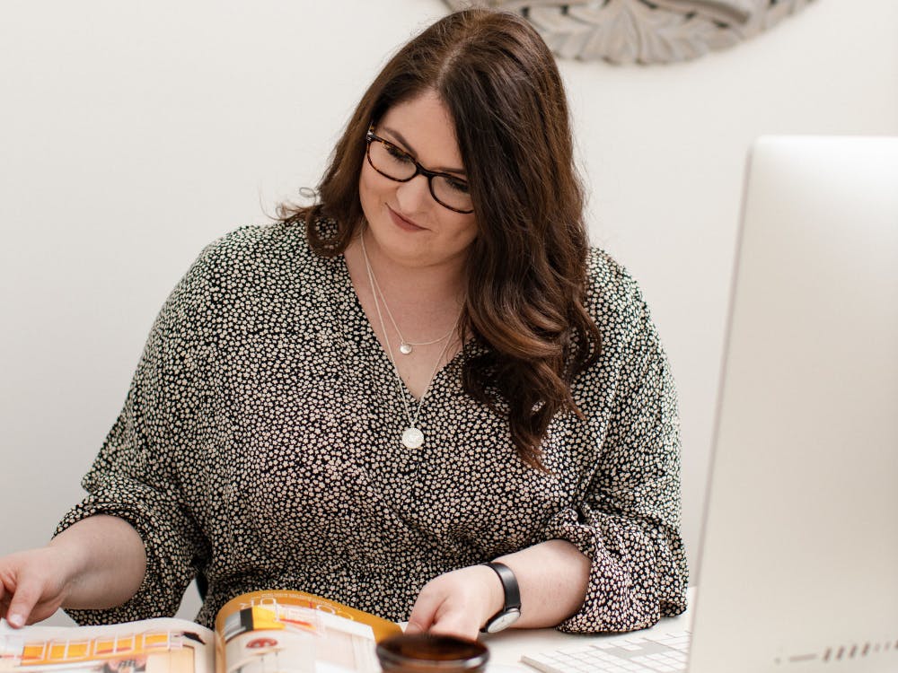 Photo of Emma, marketing strategist flicking through a magazine