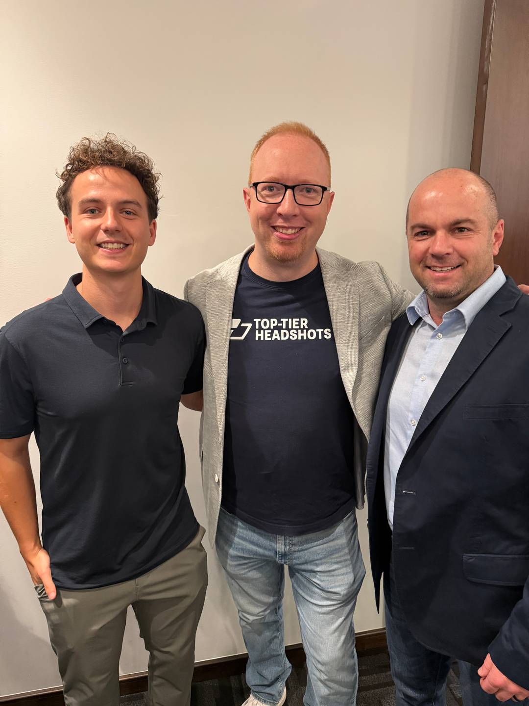 Nick Berry stands with Daniel Wakefield and Joe Gannon, all three smiling together at a business event.