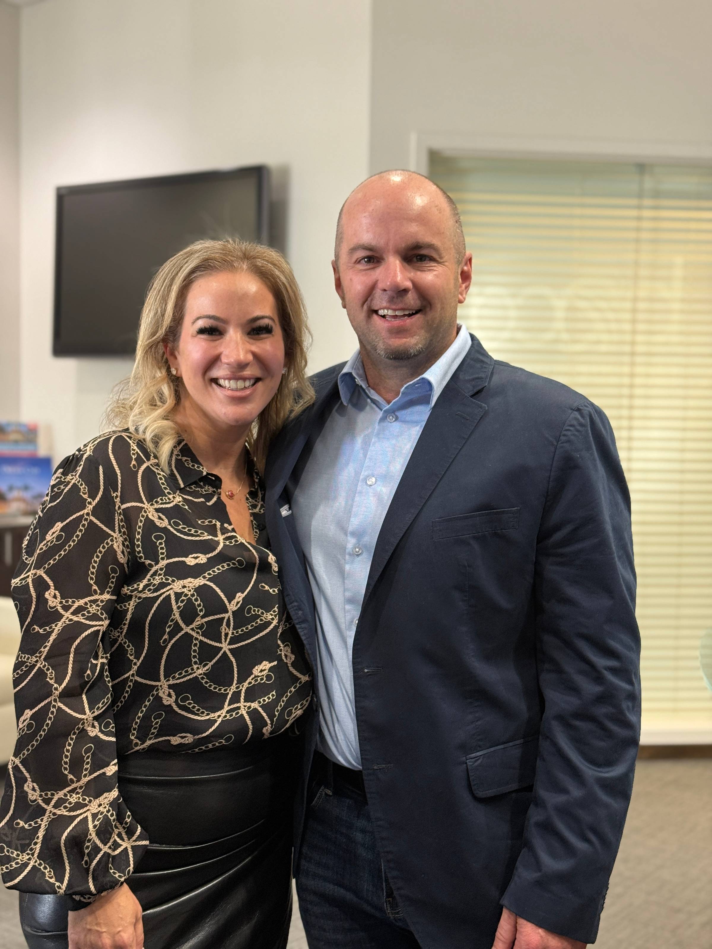 Nick Berry poses with Jessica Cohen at the Centsible Solutions ribbon cutting event hosted by the Boca Raton Chamber of Commerce.