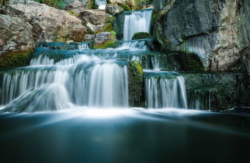 Waterfall with multiple levels, in the daytime.