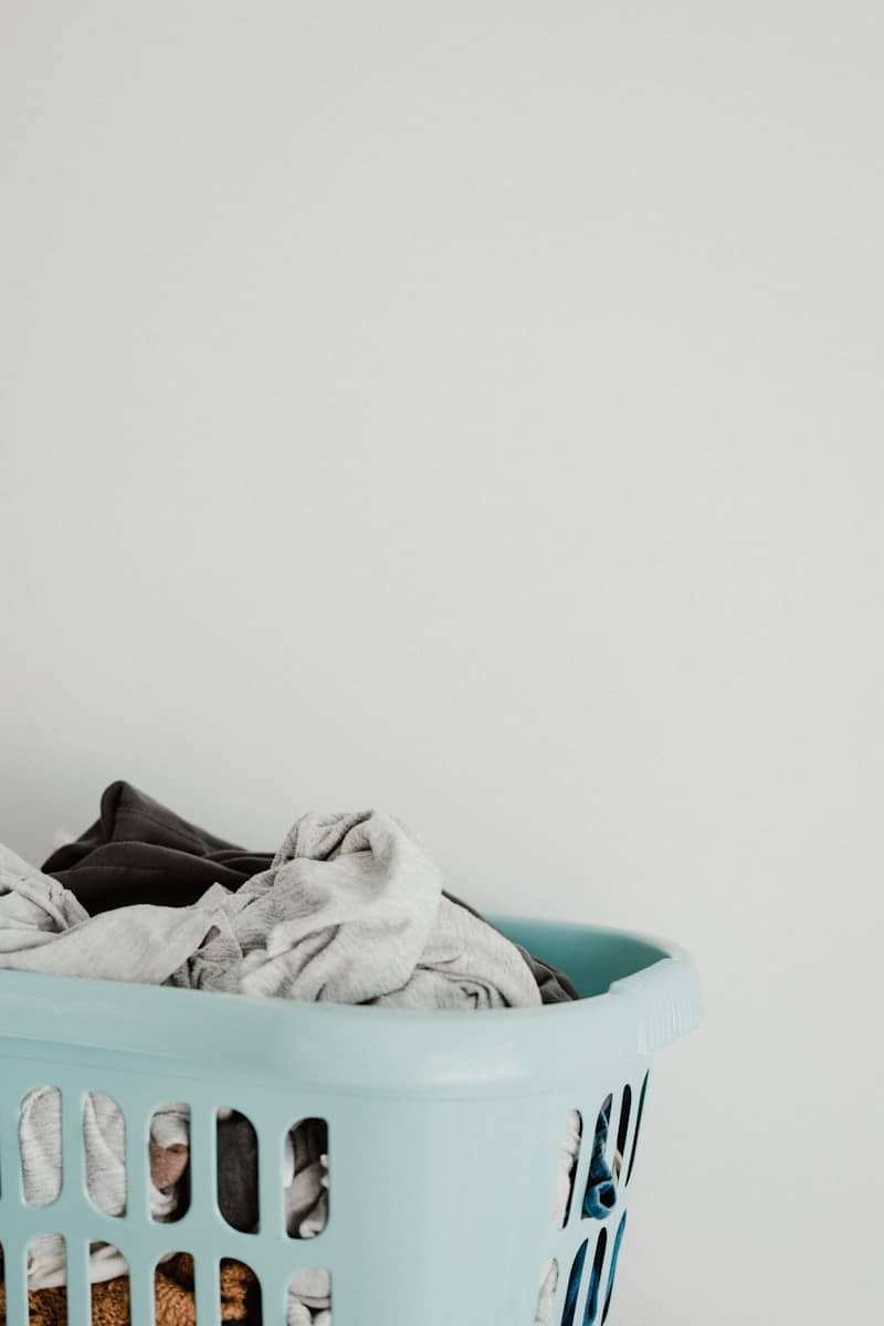 white textile in blue plastic container