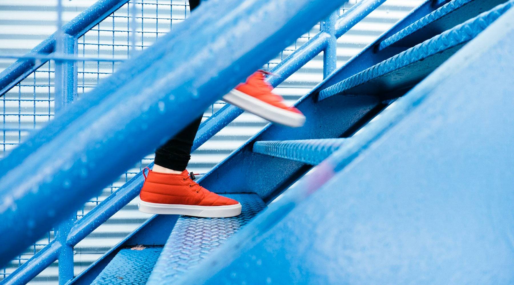 differentiate orange sneakers going up stairs
